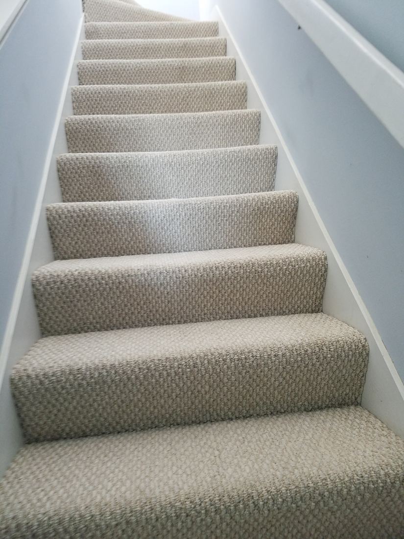 Before: Carpeted stairs to stained hardwood