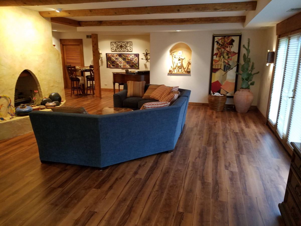 After: Living room, new vinyl plank throughout
