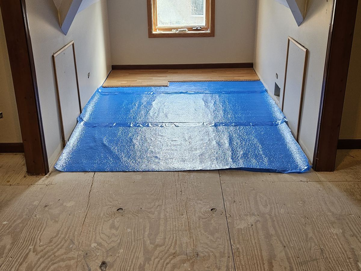 Before: Attic room, bare plywood to hardwood
