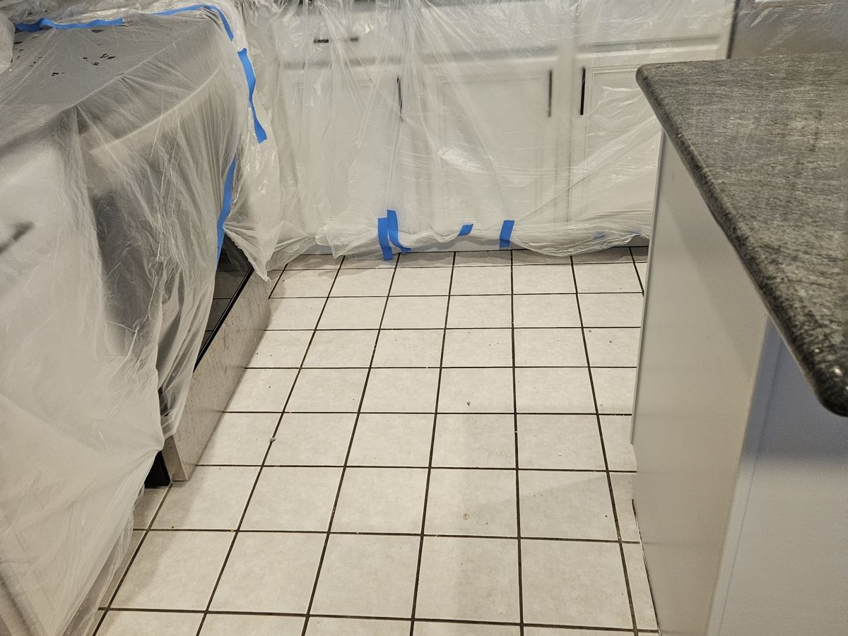 Before: Tile kitchen to hardwood
